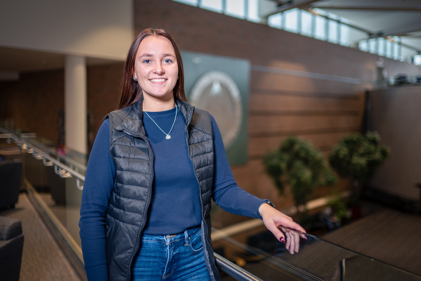 Serena Hart standing at balcony railing